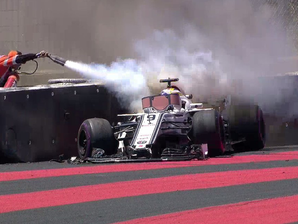 Ericsson on fire; Perez’s wheel comes clean off