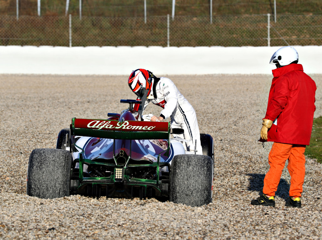 Raikkonen beaches newly-launched Alfa Romeo