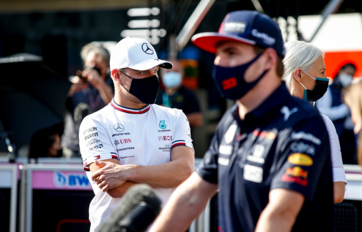 Max Verstappen speaking to the press with Valtteri Bottas in the background. Mexico November 2021