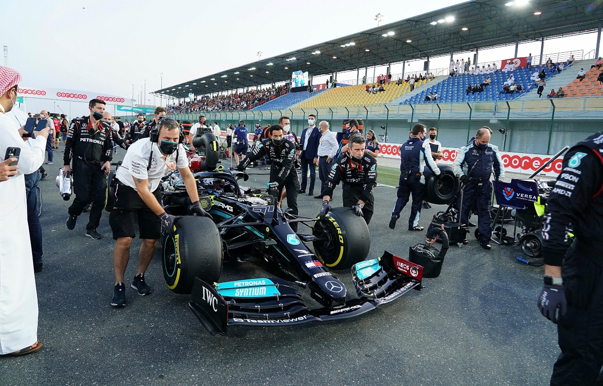Mercedes push Valtteri Bottas' car to its grid spot. Qatar November 2021
