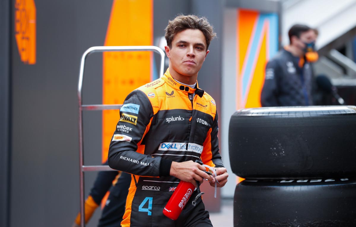 Lando Norris walks in the paddock. Barcelona February 2022.