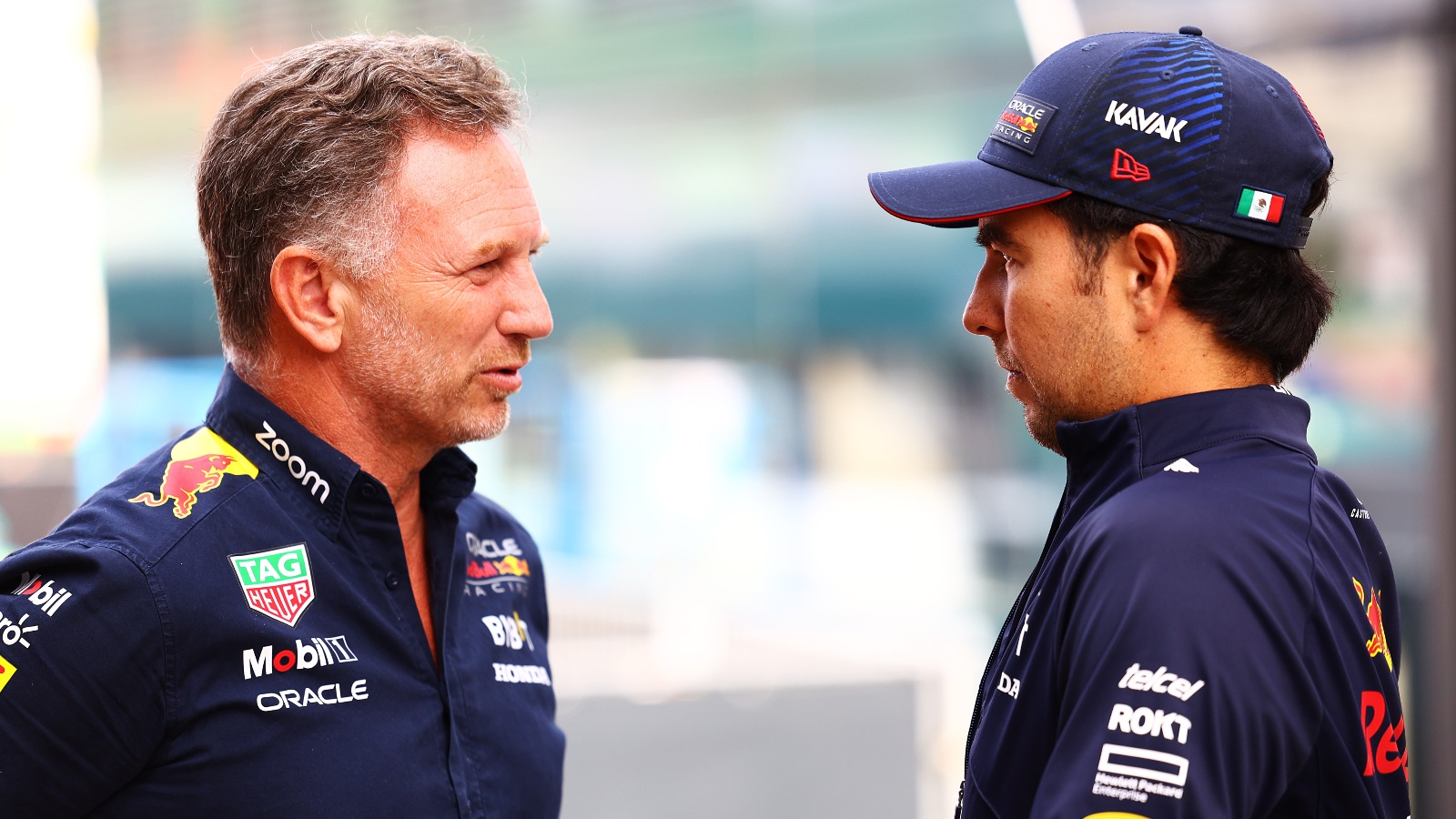 Christian Horner speaks to Sergio Perez