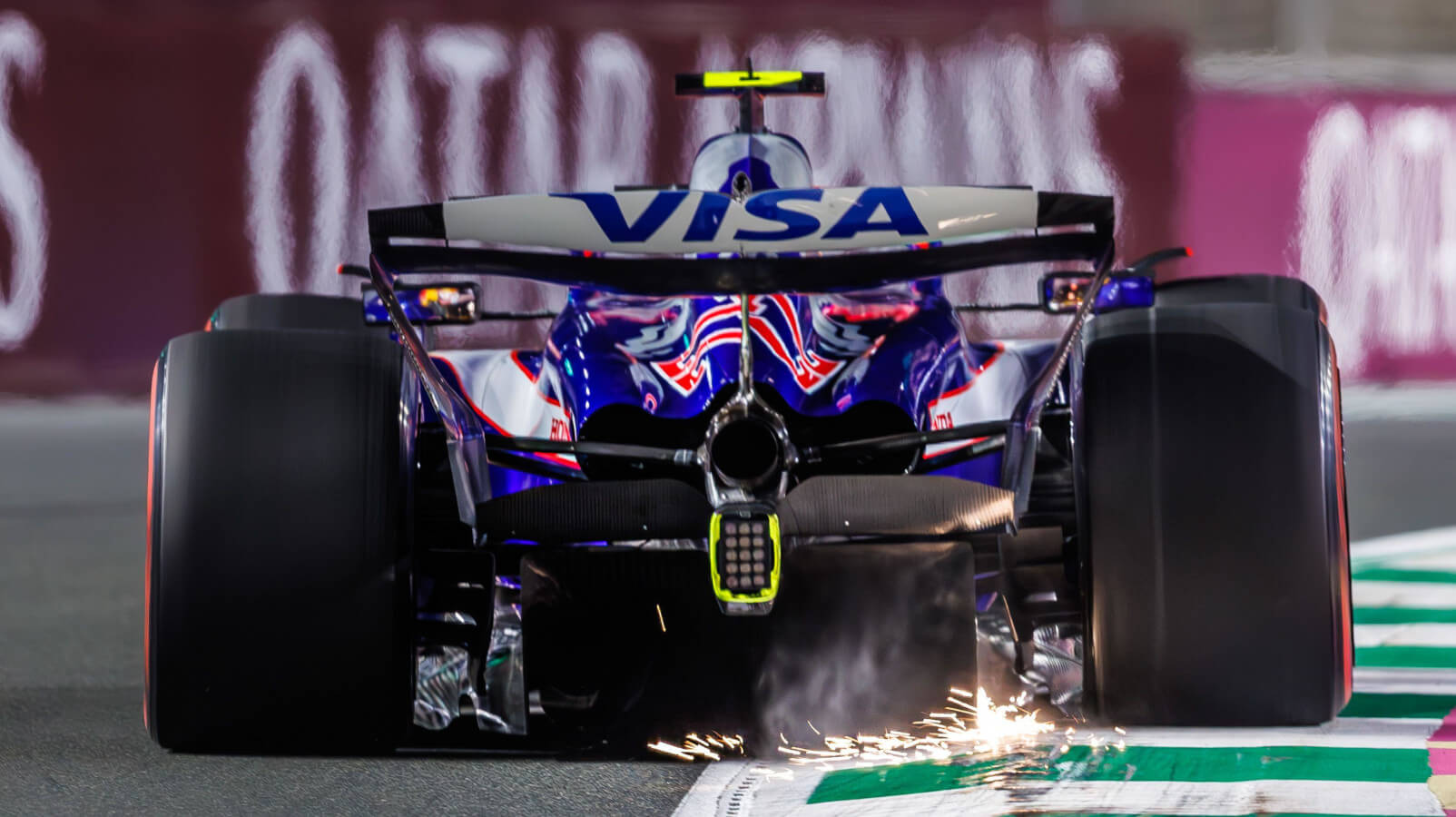 Yuki Tsunoda from behind, sparks flying