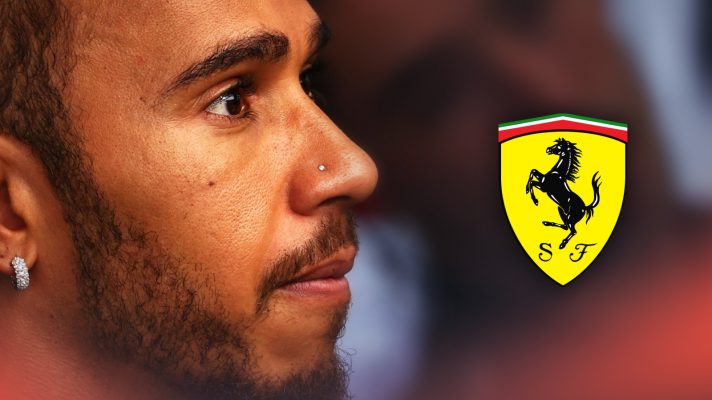 Lewis Hamilton looks tense with a prominent Ferrari logo alongside him