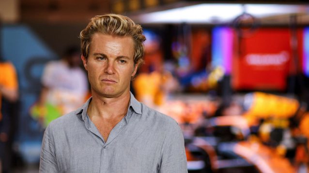 Nico Rosberg standing in front of a McLaren