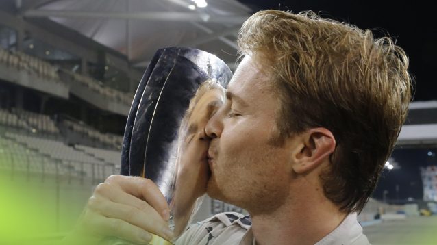 Nico Rosberg kisses his trophy after being crowned World Champion at the 2016 Abu Dhabi Grand Prix