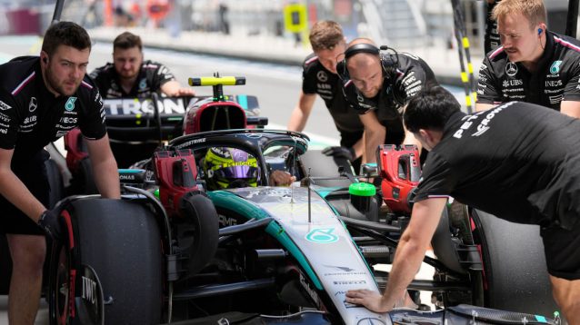 Lewis Hamilton pit lane with his Mercedes mechanics