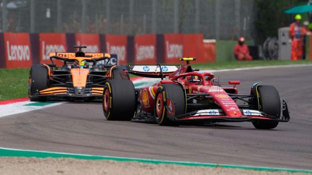 Oscar Piastri held up by Carlos Sainz.
