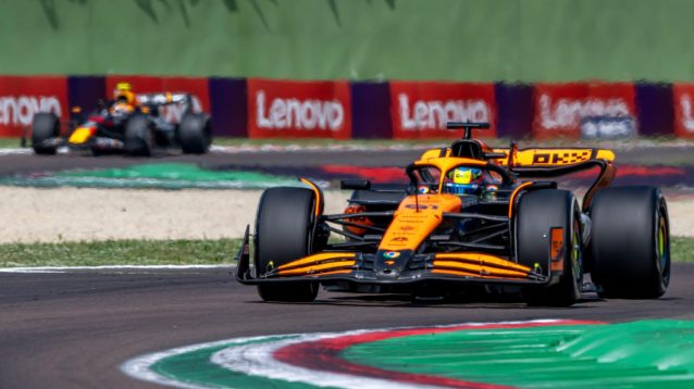 McLaren's Oscar Piastri ahead of a Red Bull at Imola.