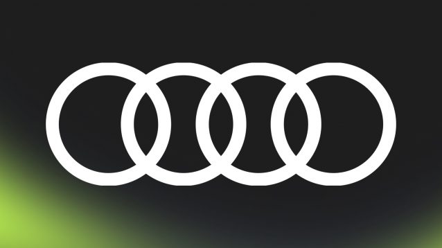 A white Audi logo against a black background with PlanetF1.com's lime-green mist at the bottom