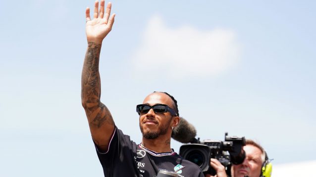 Lewis Hamilton waves to the crowd ahead of the 2024 Emilia Romagna Grand Prix.