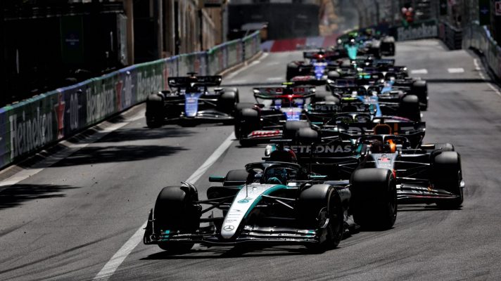 Cars follow the Mercedes of George Russell at the 2024 Monaco Grand Prix.