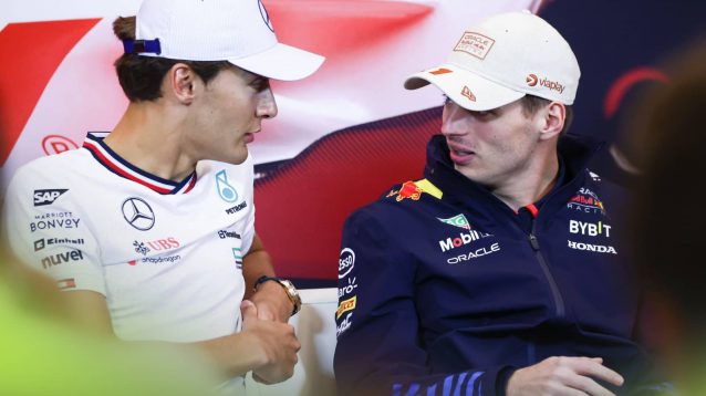 George Russell and Max Verstappen chat during the Monaco Grand Prix press conference