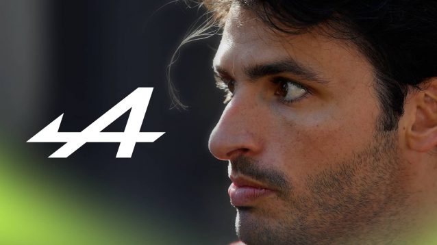 A close-up shot of Carlos Sainz with a prominent Alpine logo alongside him