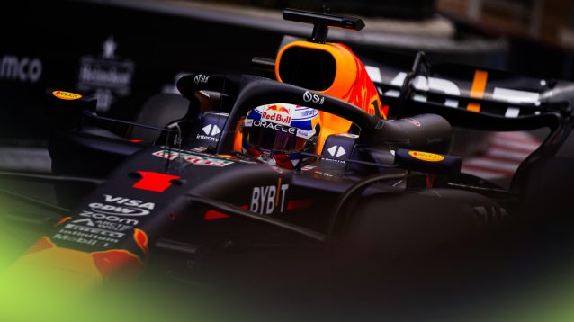 A dramatic shot of Max Verstappen's Red Bull in action at the 2024 Monaco Grand Prix