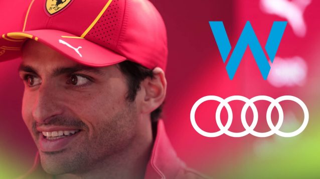 Carlos Sainz smiles with prominent Williams and Audi logos alongside him
