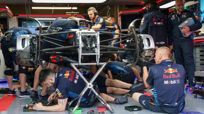 Red Bull mechanics working on Max Verstappen's RB20