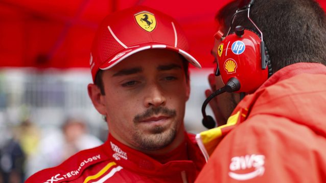 Charles Leclerc speaking with Ferrari engineer