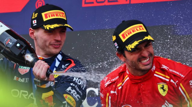 Max Verstappen and Carlos Sainz spray champagne on the podium at Suzuka