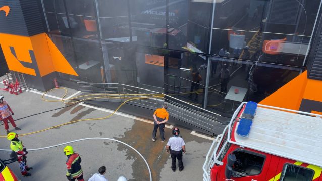 McLaren Racing CEO Zak Brown assesses the damage after a hospitality fire at the 2024 Spanish Grand Prix.