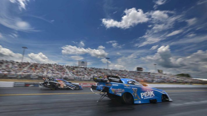John Force races down the track at the opening round of the NHRA Virginia Nationals, 2024.