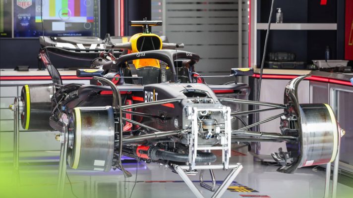 Max Verstappen's Red Bull RB20 siits stripped down in the garage in Austria