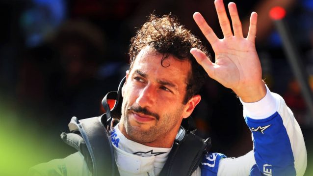 Daniel Ricciardo waves to the fans