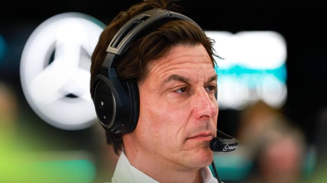 Toto Wolff wearing a headset in the Mercedes garage in Austria