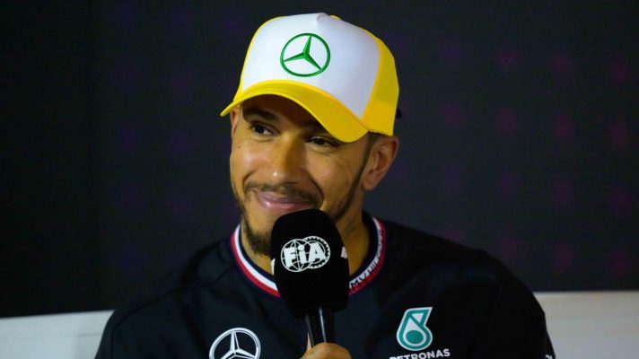 Lewis Hamilton smiles in the British GP press conference.