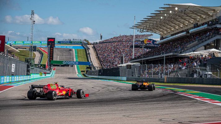 A Ferrari chases a Red Bull at the Circuit of the Americas during the Formula 1 United States Grand Prix