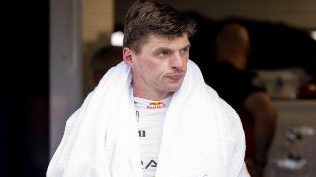Red Bull's Max Verstappen with a towel over his shoulders in the paddock at the 2024 Hungarian Grand Prix.