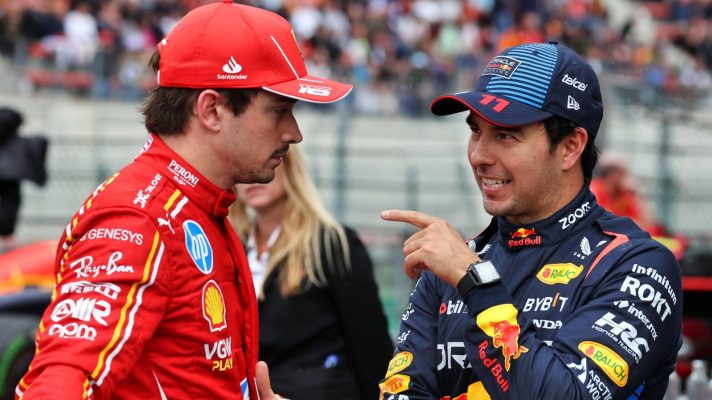 Red Bull's Sergio Perez points while talking to Ferrari's Charles Leclerc after 2024 Belgian GP qualifying.