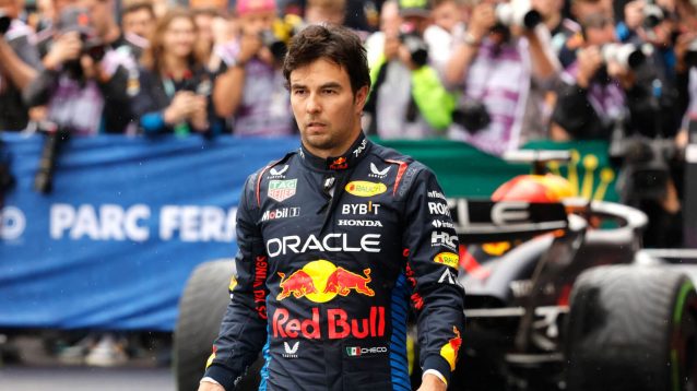 Sergio Perez walks away from his Red Bull RB20