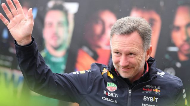 Christian Horner waves at a rainy Silverstone