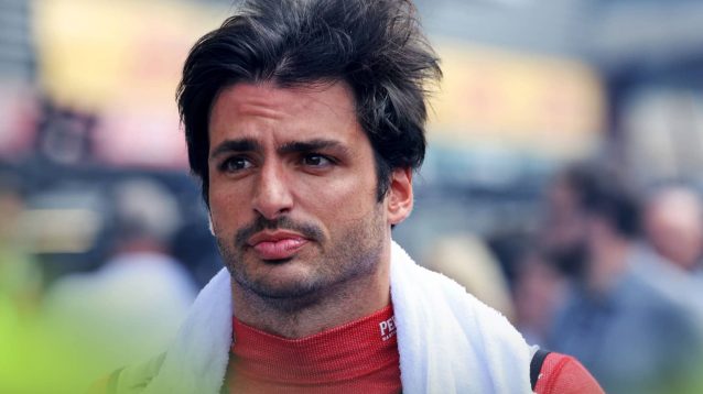 Carlos Sainz with a towel over his shoulders on the grid at Spa