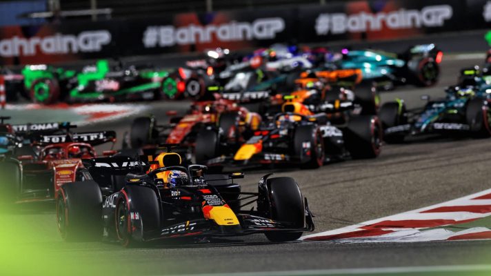 Max Verstappen enters Turn 2 in Bahrain as the rest of the field battle in the background behind him