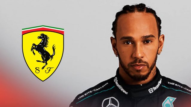 A studio shot of Lewis Hamilton starting at the camera with a prominent Ferrari logo alongside him
