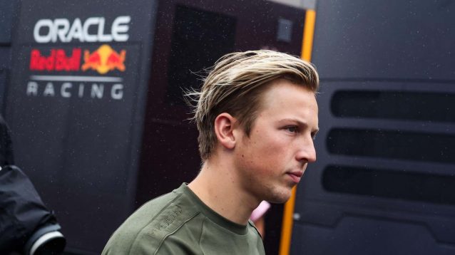 Liam Lawson in front of the Red Bull garage.