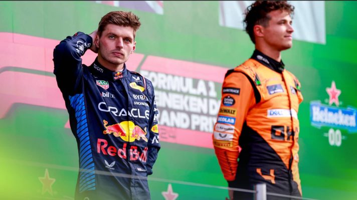 Max Verstappen scratches the back of his head as Lando Norris looks on during the podium ceremony at Zandvoort