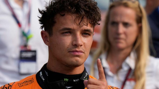 Lando Norris shows the '1' finger at the 2024 Italian Grand Prix after qualifying.
