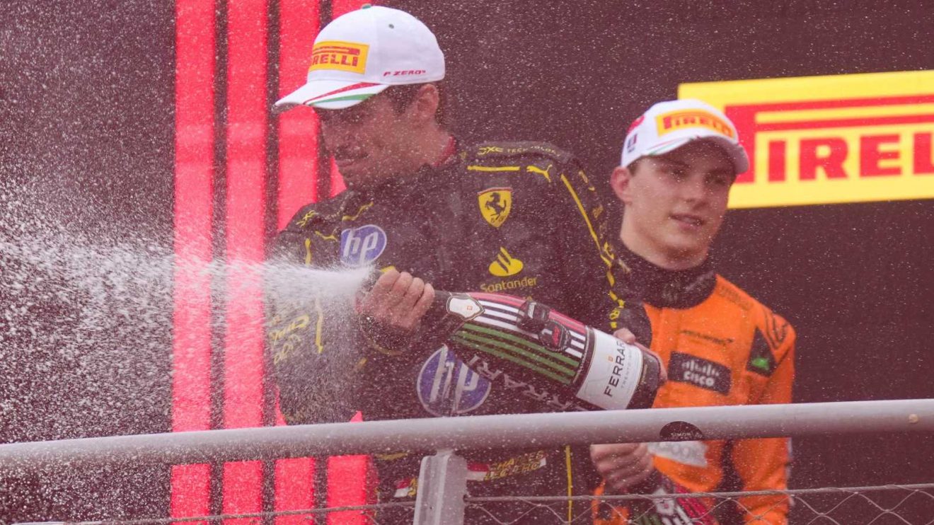 Charles Leclerc in front of Oscar Piastri on the podium after winning the 2024 Italian Grand Prix.