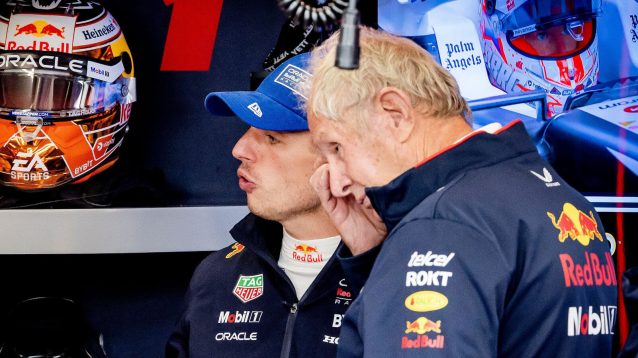 Helmut Marko head down with Max Verstappen in the Red Bull garage