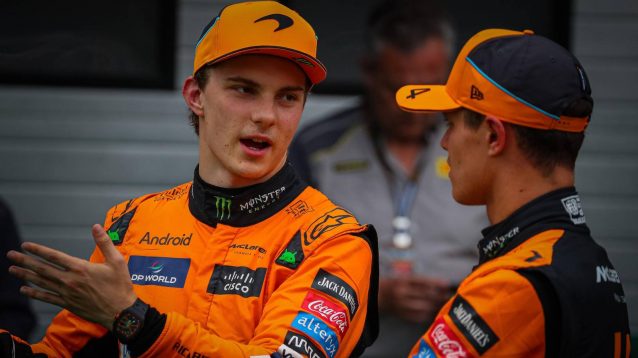 McLaren team-mates Oscar Piastri and Lando Norris talk at the 2024 Hungarian Grand Prix.