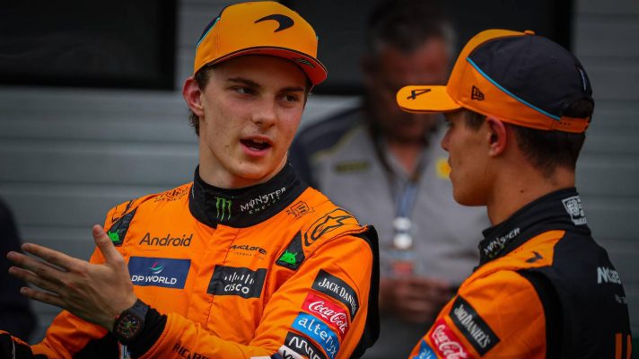 McLaren team-mates Oscar Piastri and Lando Norris talk at the 2024 Hungarian Grand Prix.