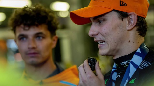 Oscar Piastri looks worried as Lando Norris looks on darkly