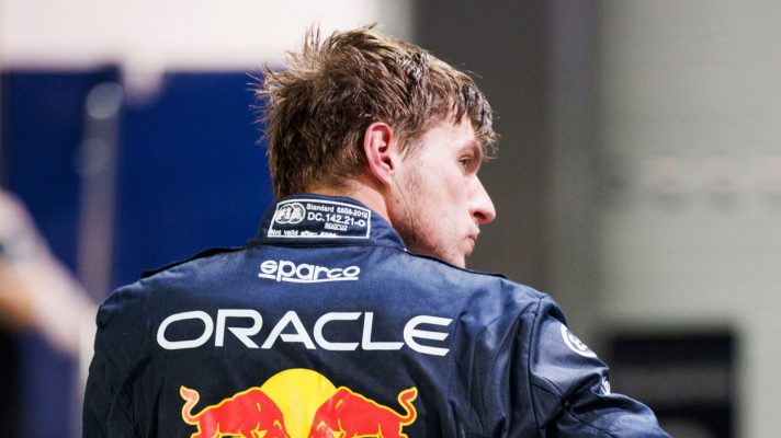 Max Verstappen with his back to the camera