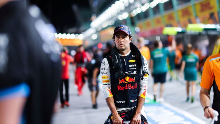 Sergio Perez scooting down the pit lane