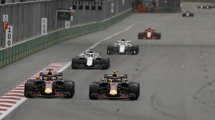 Red Bull's Max Verstappen and Daniel Ricciardo battle at the 2018 Azerbaijan Grand Prix.