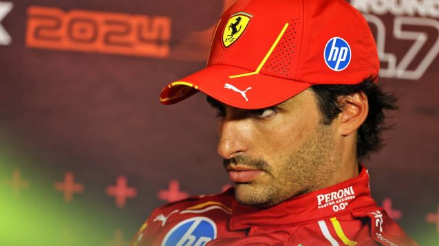 Carlos Sainz sits moodily in a press conference in Baku