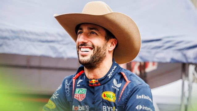 Daniel Ricciardo smiles as he dons a cowboy hat